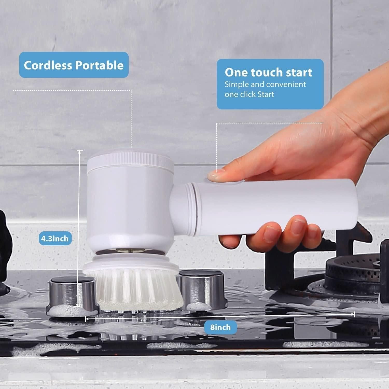 The white handheld cleaning brush is cleaning a stove, and the image shows that it is cordless and portable, as well as a one touch start which makes it simple and convenient to use.